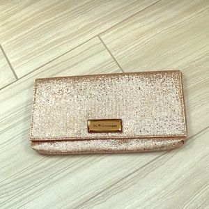 BCBG rose gold sequin clutch